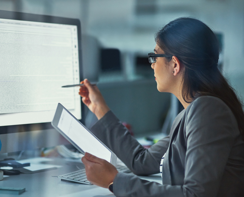 Side View Of Woman Pensively Looking At Computer Screen Focused