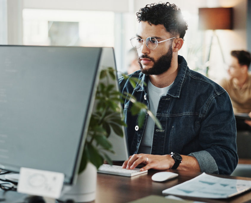 Side View Of Young Male Programmer